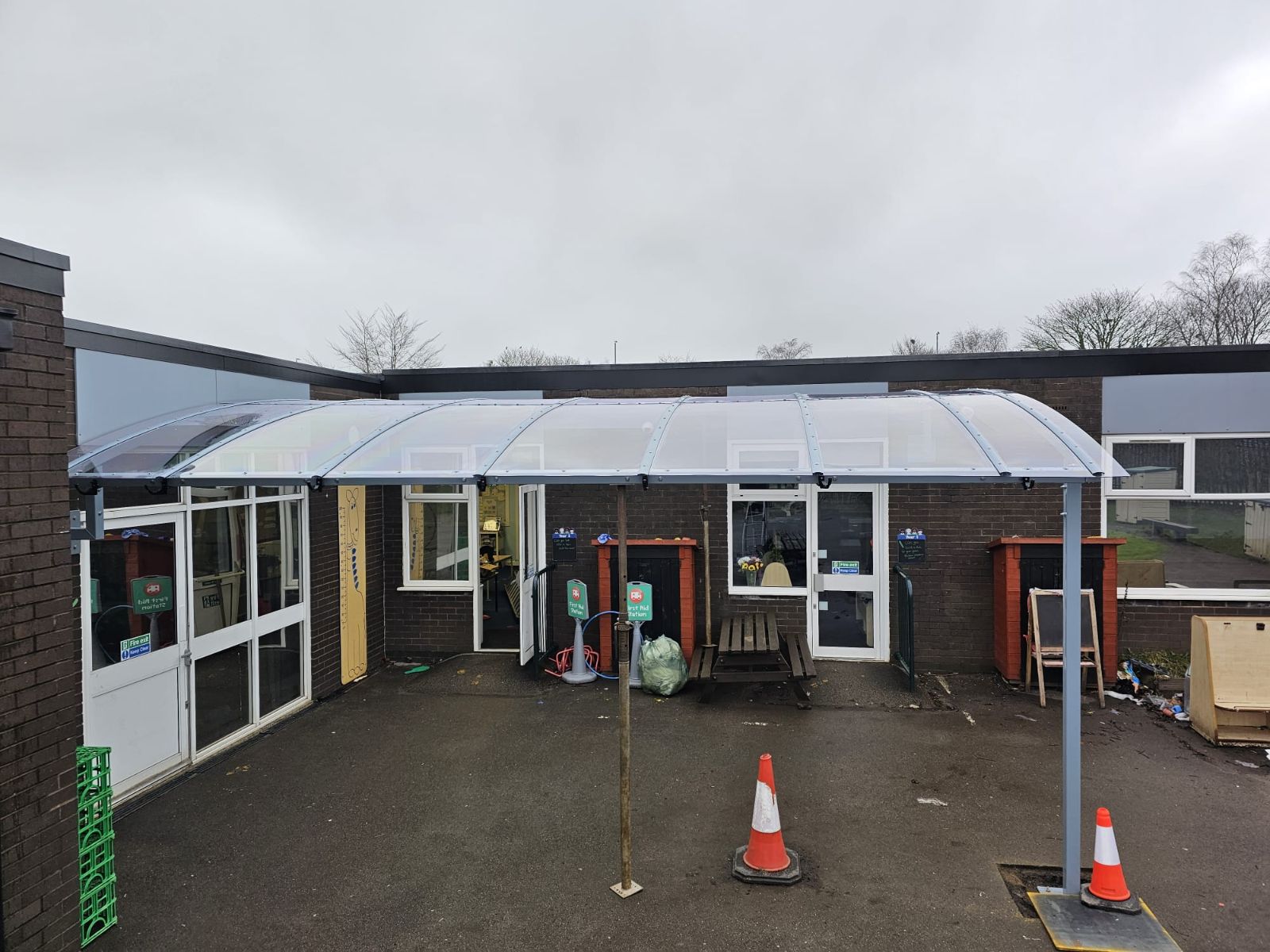 Covered walkway canopy at a school, installed by Canopies & Shelters Ltd