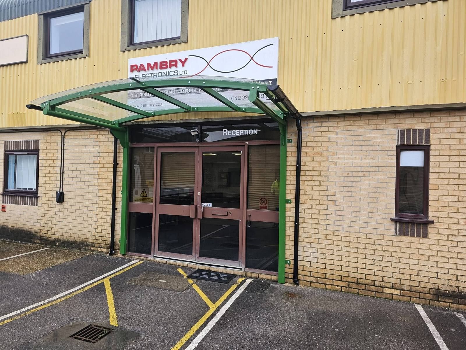 Cantilever entrance canopy installed near Poole by Canopies & Shelters Ltd