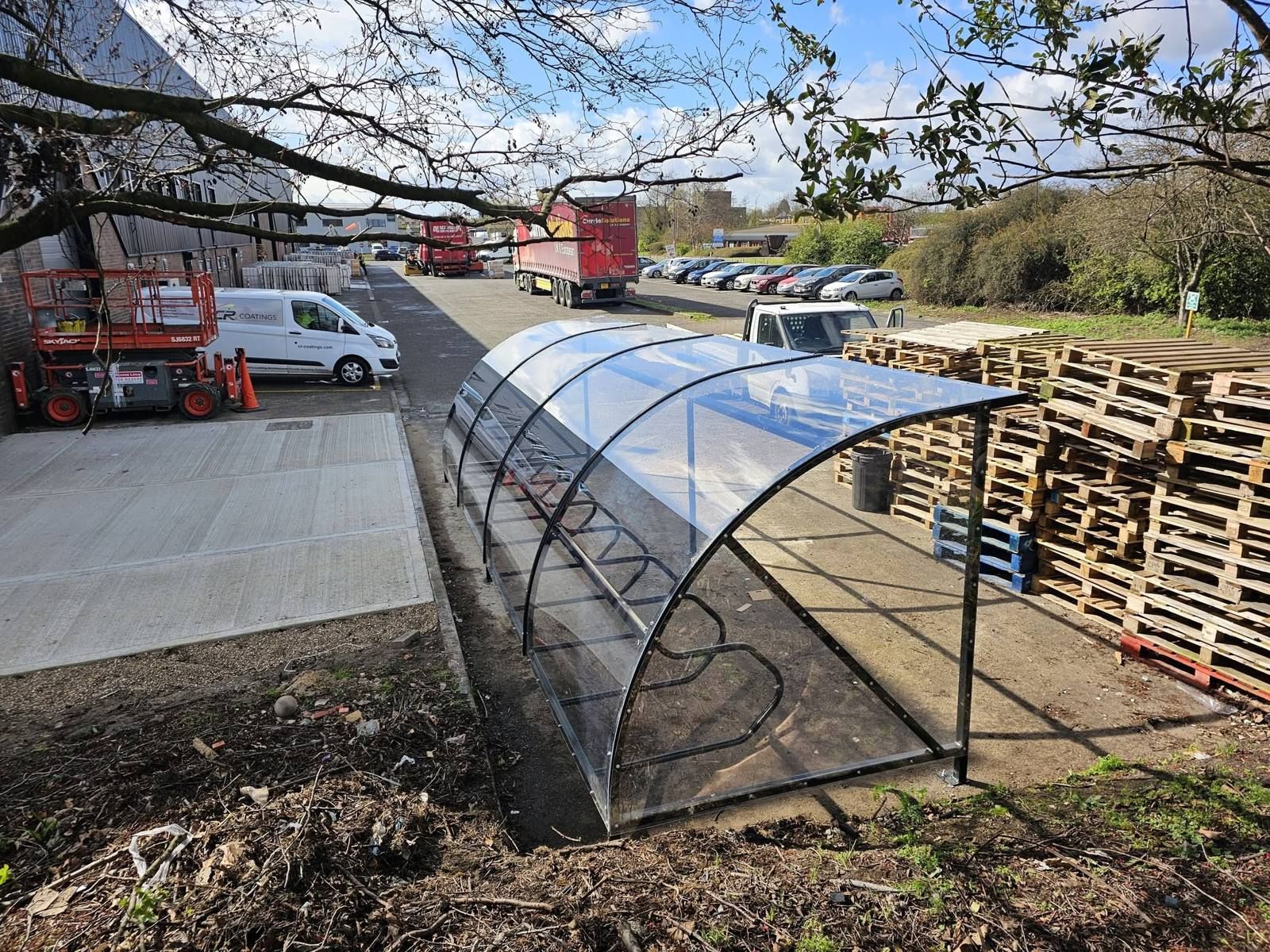 Black curved cycle shelter at The Scent Reserve, Scunthorpe