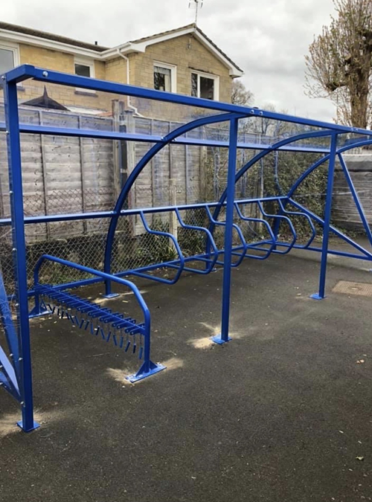 Blue cantilever cycle shelter with a cycle rack