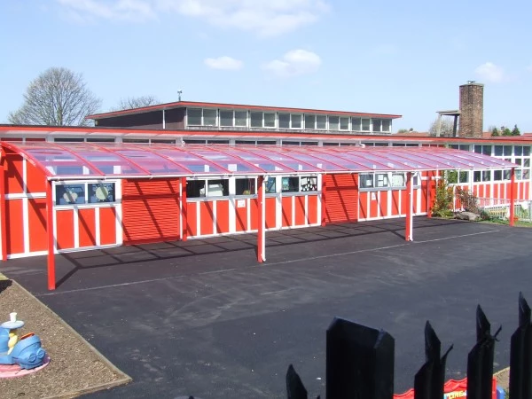 Red playground canopy at a school