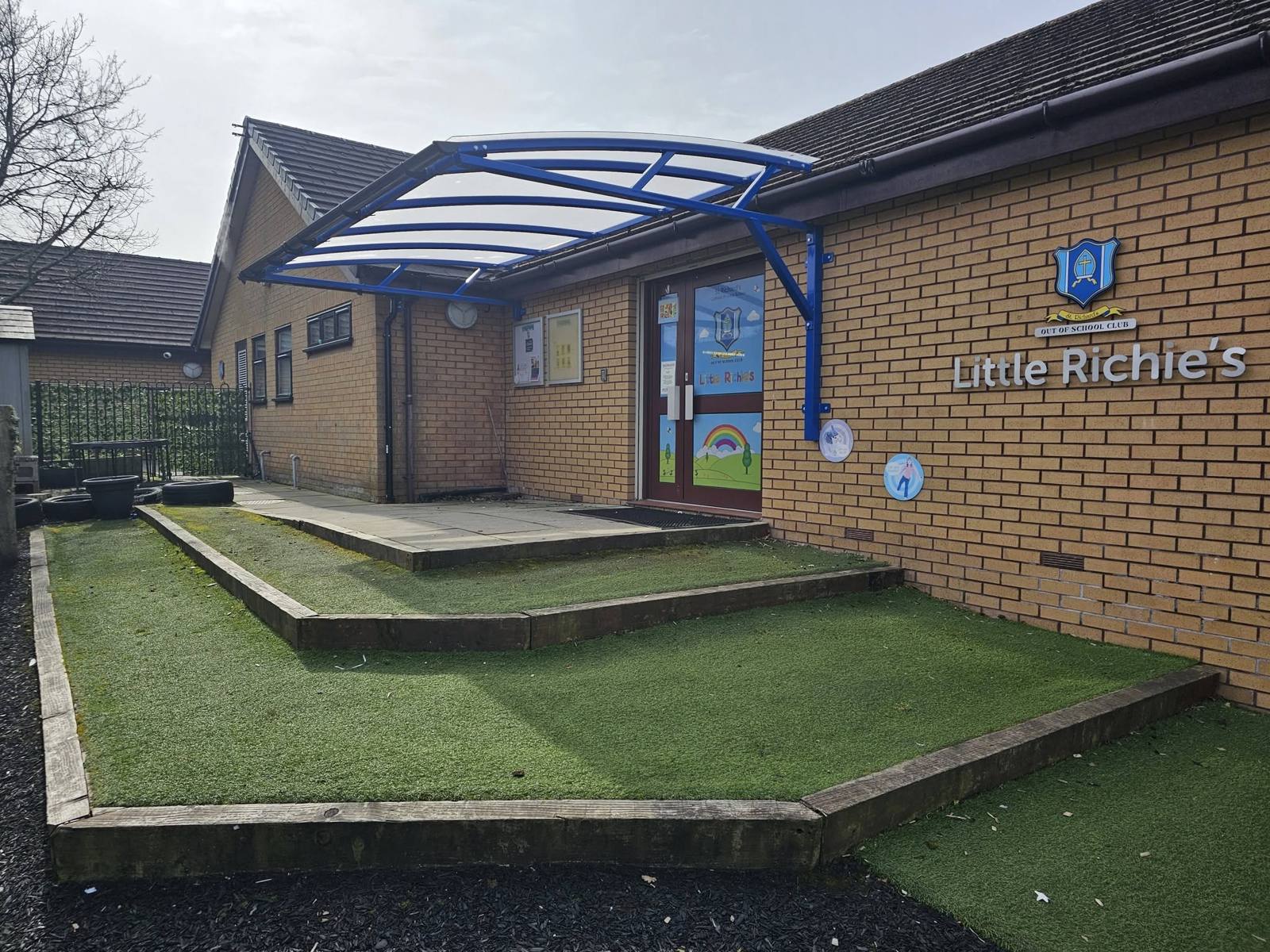 Blue cantilever canopy over a nursery entrance at St Richard's RC Primary School, Skelmersdale