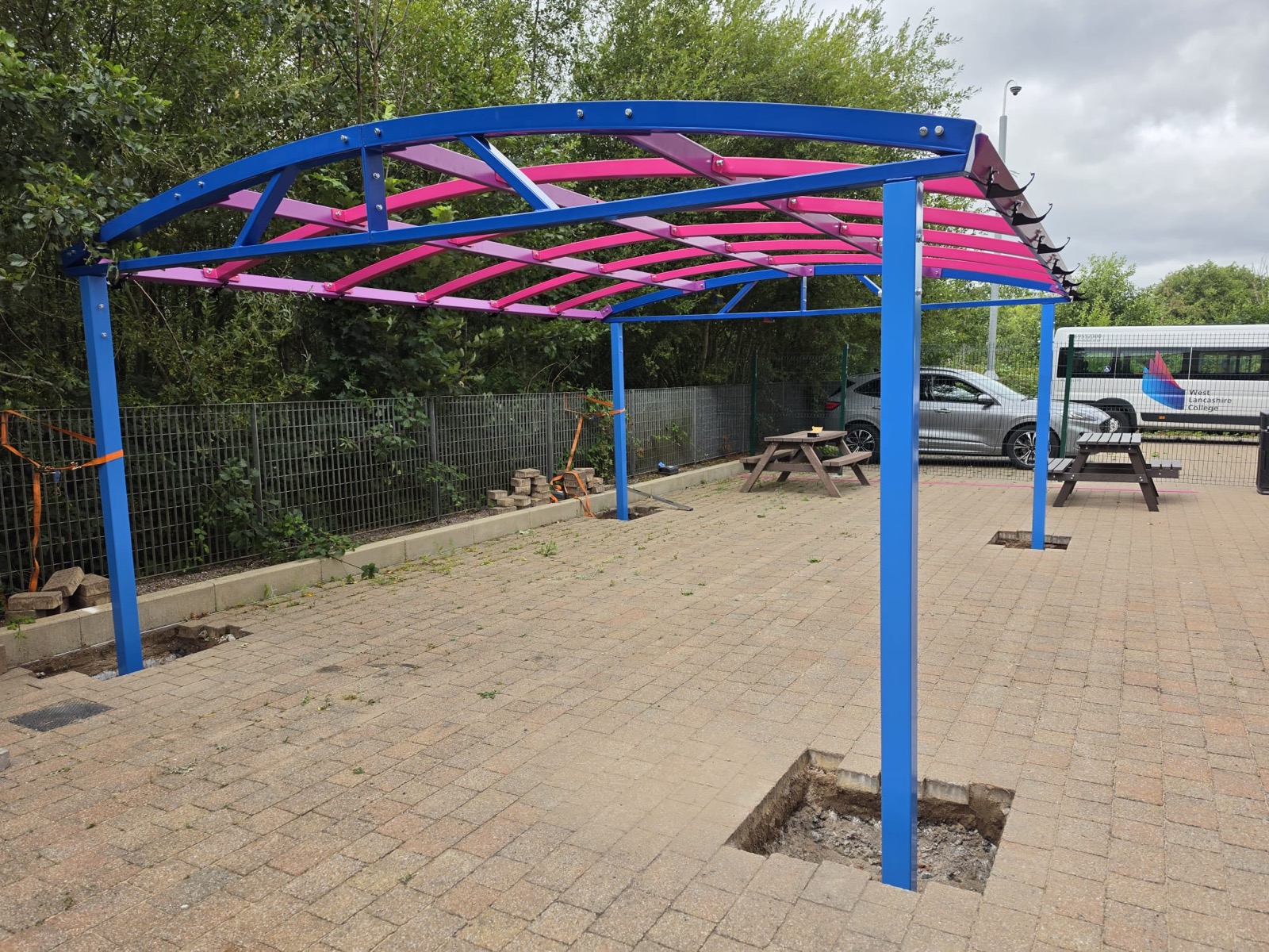 End-on view of the newly installed canopy frame with ground post holes still open